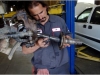 Auto Mechanic working on disassembled wheel hub